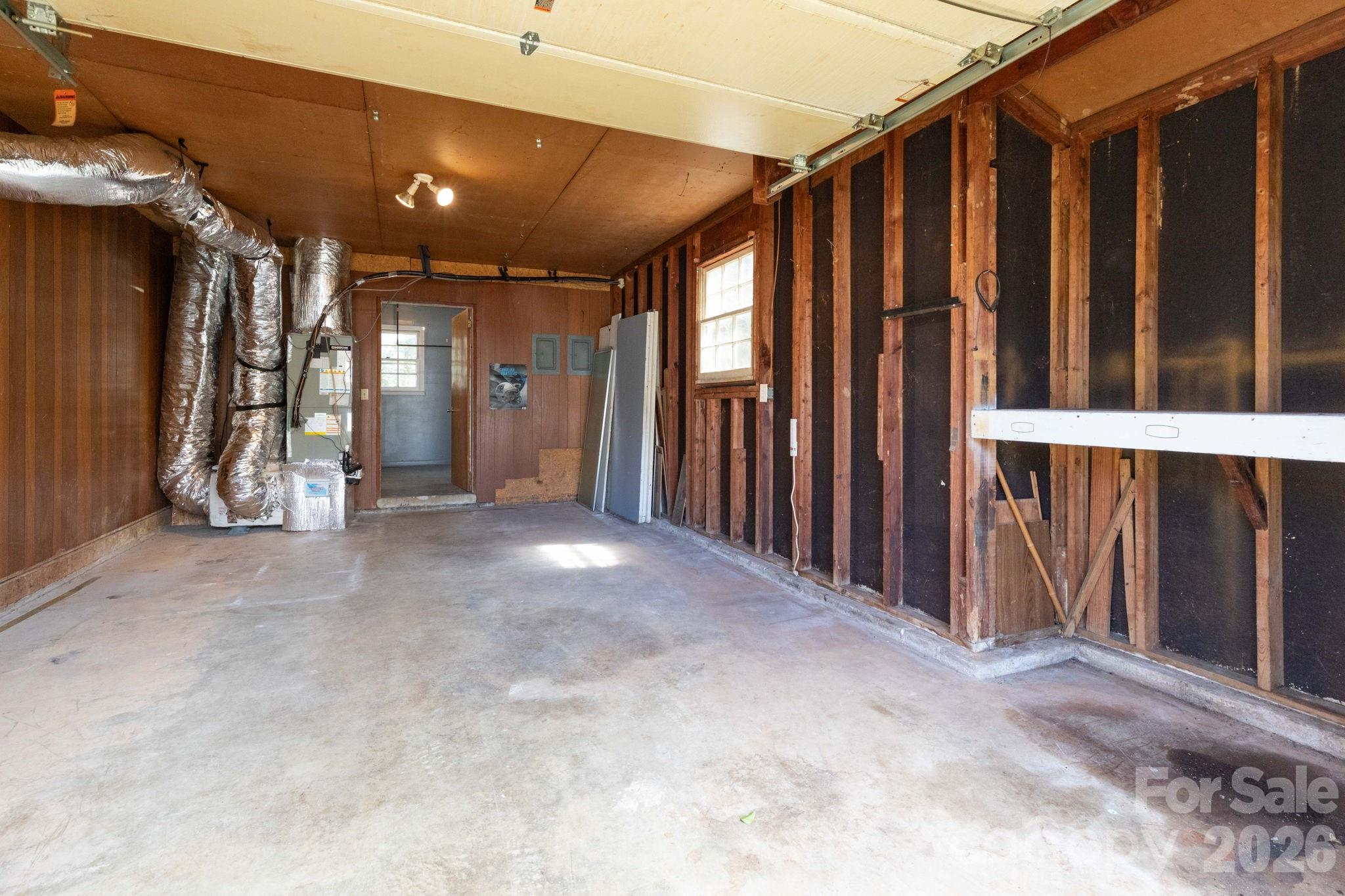 380 Woodland Church Road Clyde, NC 28721 - Photo 15 of 23 a view of a hallway with wooden floor