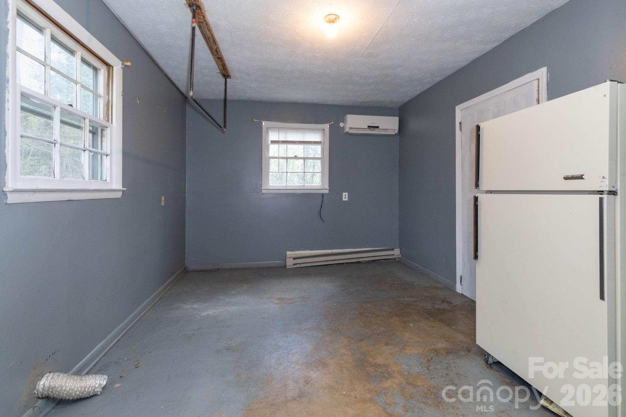 380 Woodland Church Road Clyde, NC 28721 - Photo 16 of 23 a view of an empty room with a window