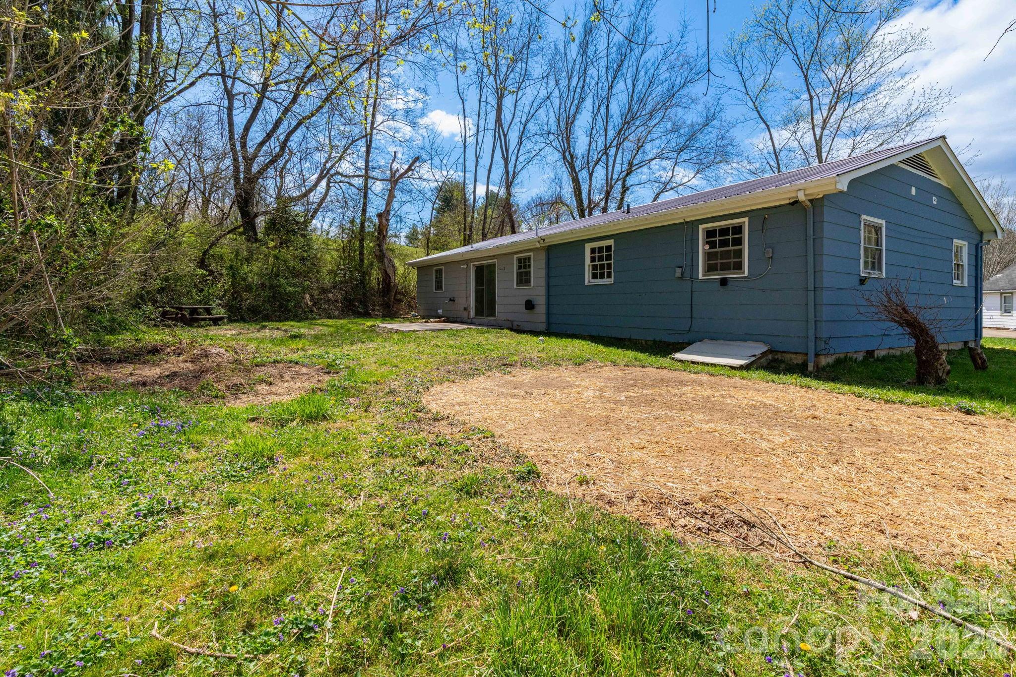 380 Woodland Church Road Clyde, NC 28721 - Photo 21 of 23 a backyard of a house