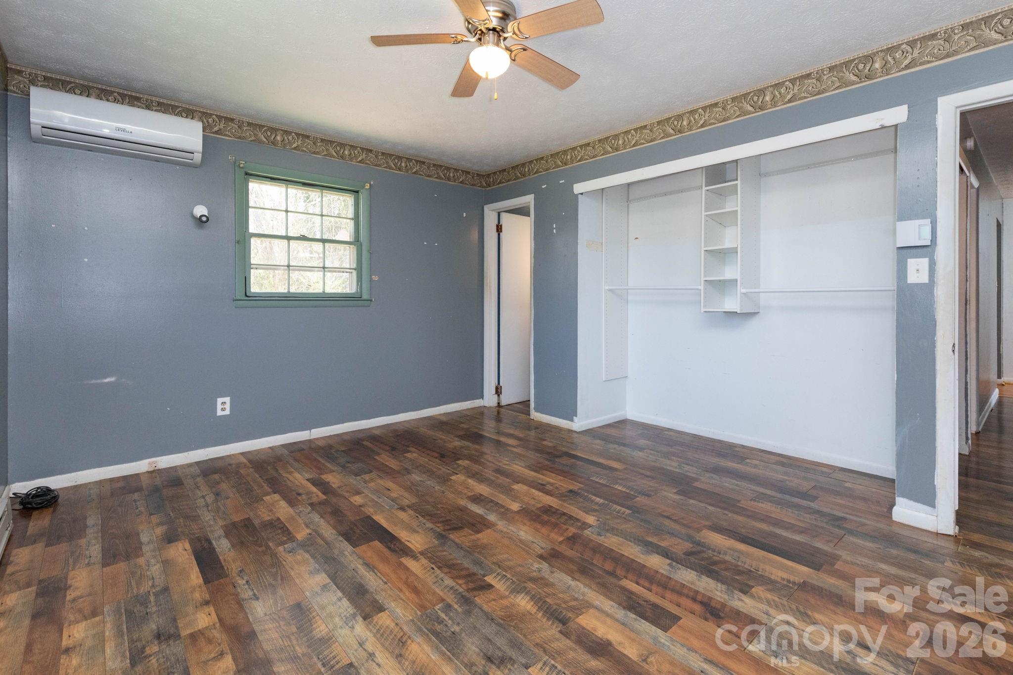 380 Woodland Church Road Clyde, NC 28721 - Photo 9 of 23 a view of an empty room with a window
