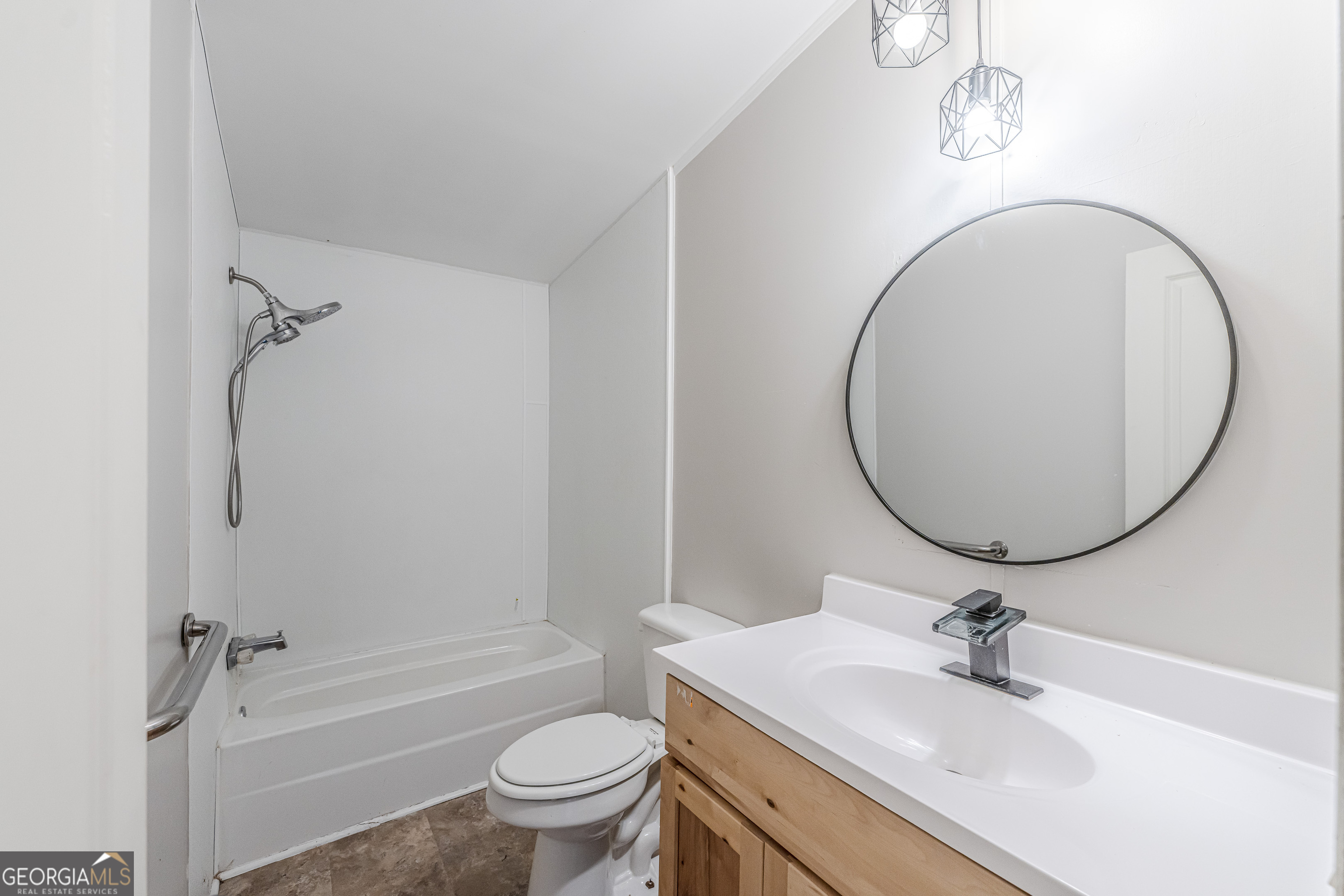 71 Kirk Road Northwest White, GA 30184 - Photo 16 of 43 a bathroom with a sink a toilet and a mirror