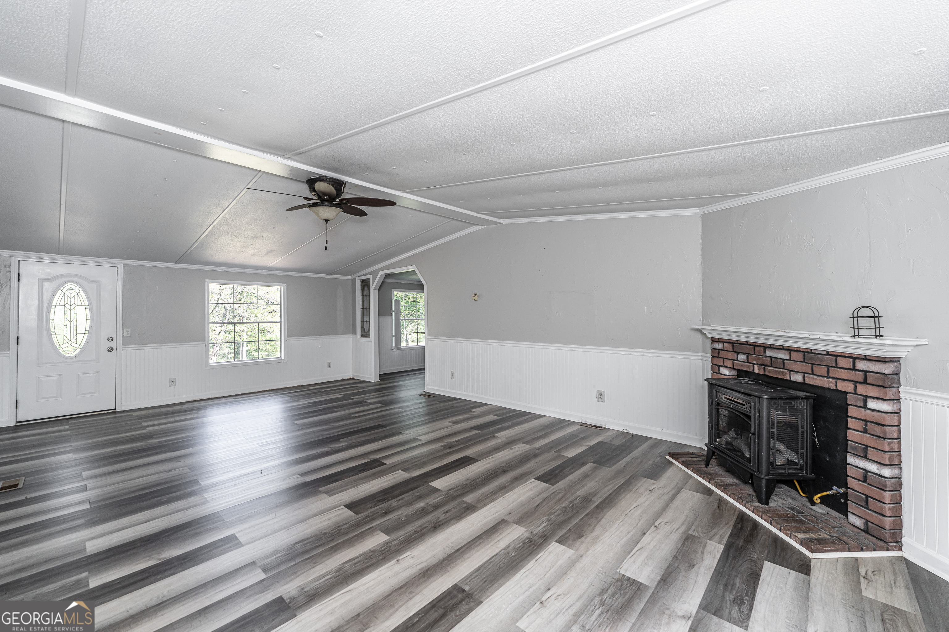 71 Kirk Road Northwest White, GA 30184 - Photo 27 of 43 wooden floor in an empty room with a fireplace