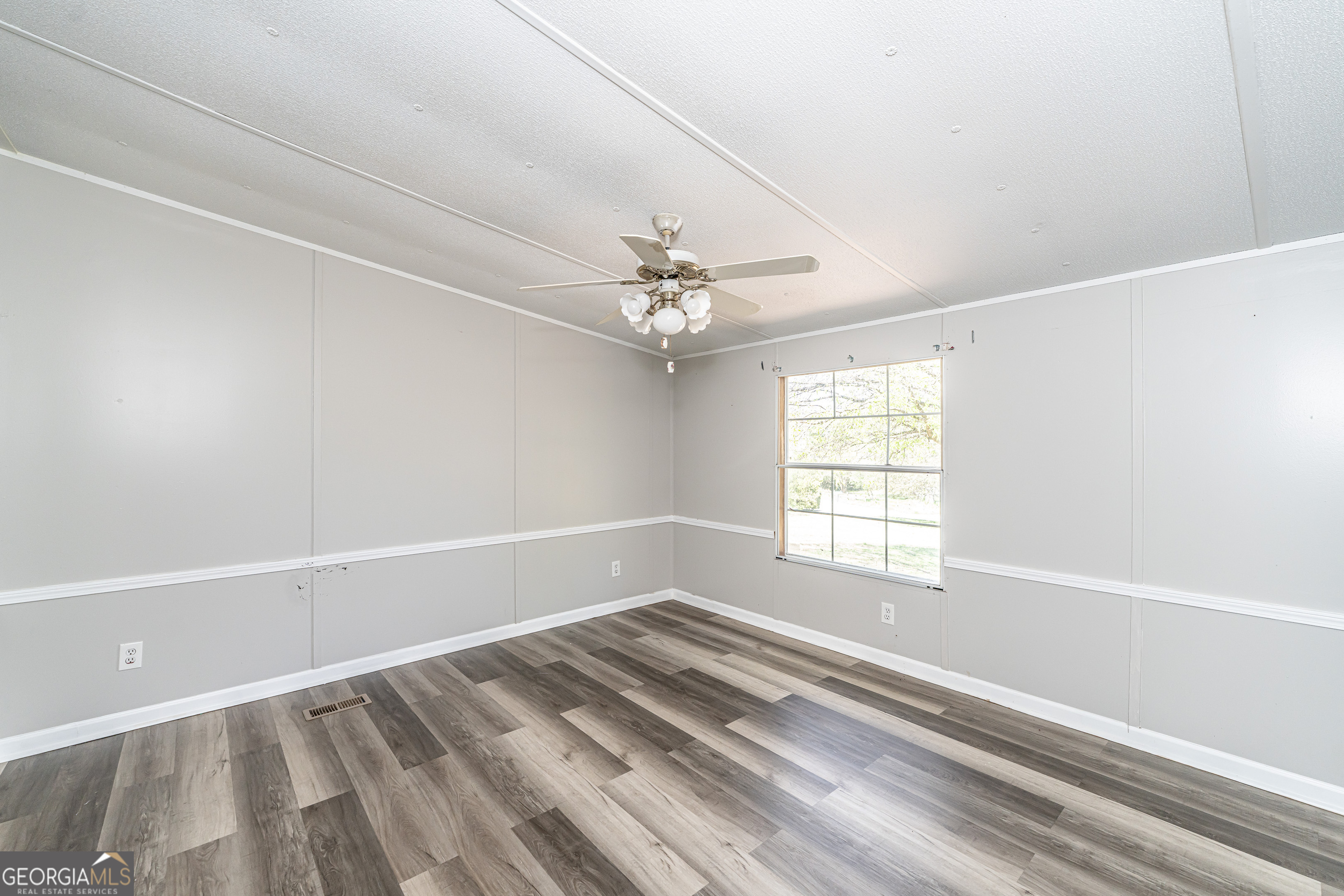 71 Kirk Road Northwest White, GA 30184 - Photo 28 of 43 a view of a livingroom with a ceiling fan and window