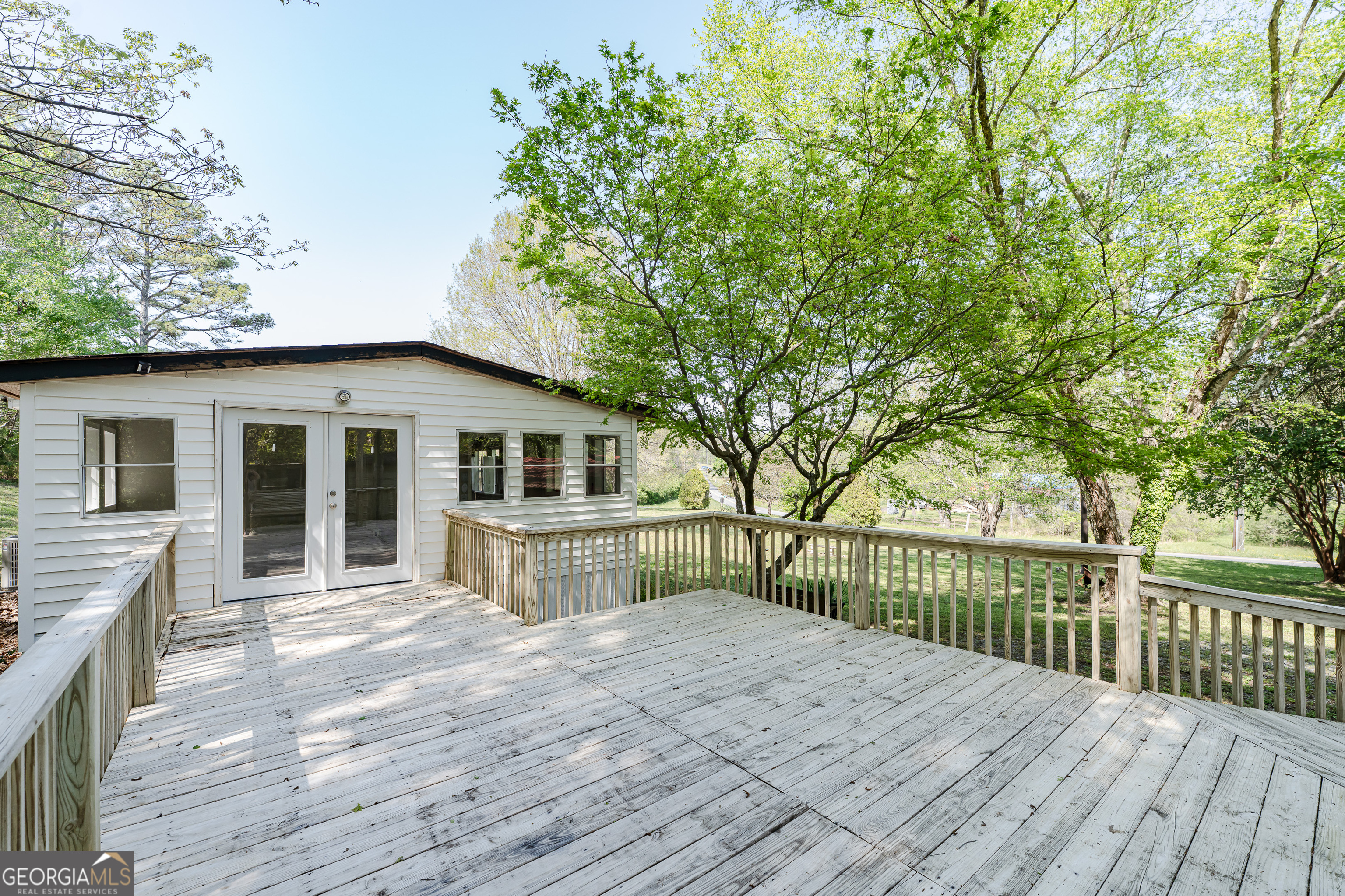 71 Kirk Road Northwest White, GA 30184 - Photo 38 of 43 a view of a house with wooden deck and a large tree