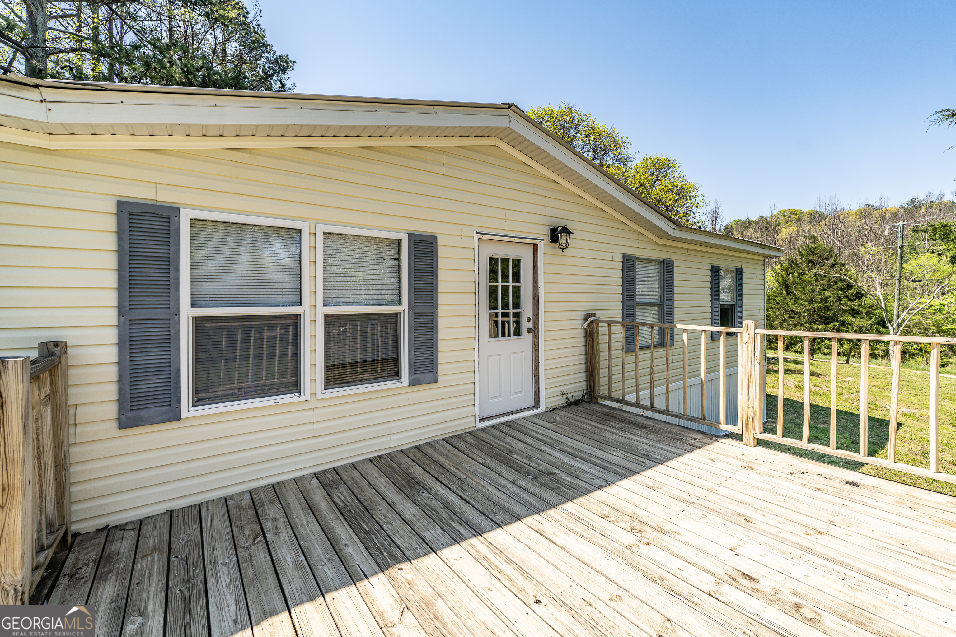71 Kirk Road Northwest White, GA 30184 - Photo 4 of 43 a view of a house with wooden deck