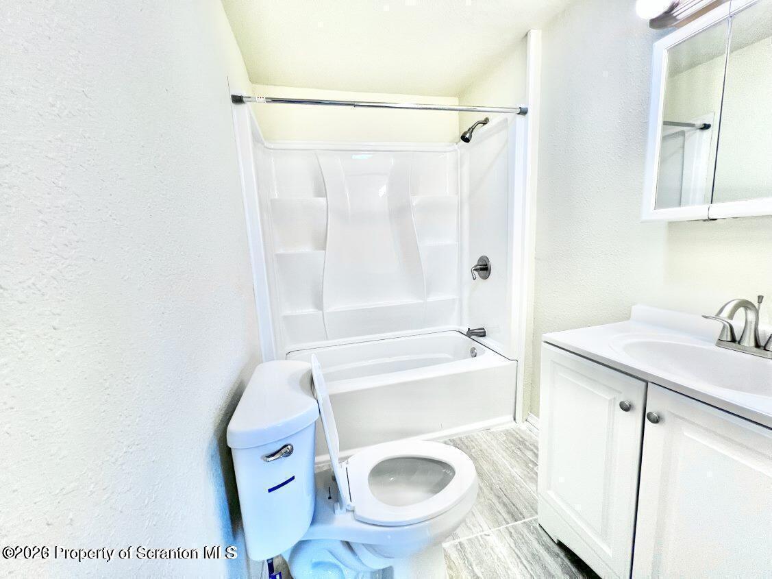 636 Beech Street, Unit 2 Scranton, PA 18505 - Photo 11 of 26 a bathroom with a sink a toilet and a bathtub