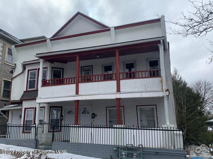 636 Beech Street, Unit 2 Scranton, PA 18505 - Photo 26 of 26 a view of a white house with large windows