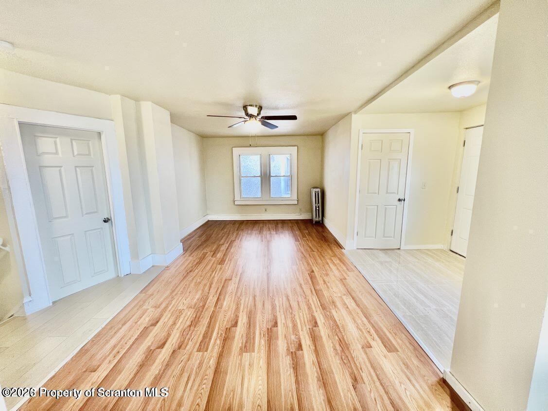 636 Beech Street, Unit 2 Scranton, PA 18505 - Photo 6 of 26 wooden floor in an empty room with a window
