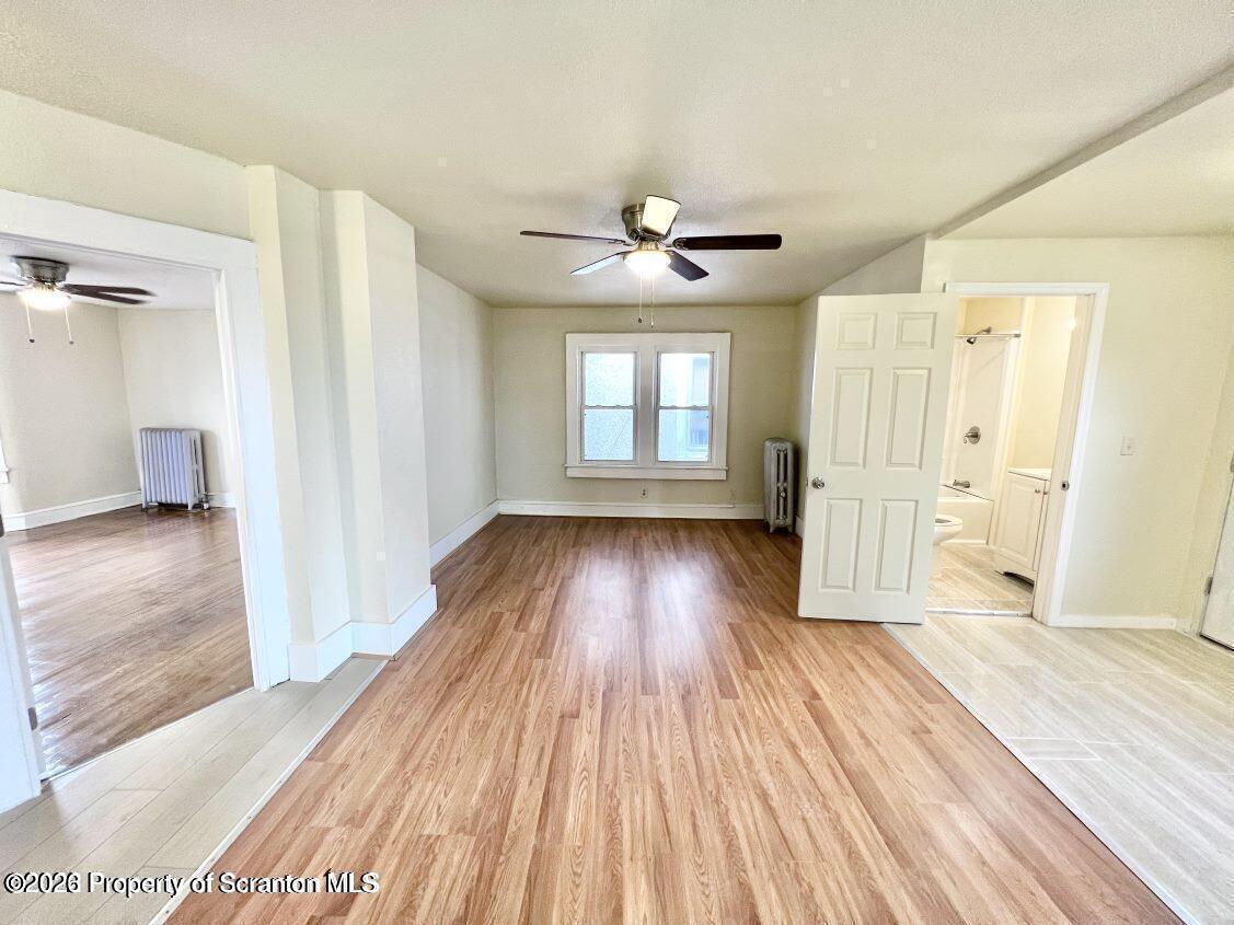 636 Beech Street, Unit 2 Scranton, PA 18505 - Photo 7 of 26 wooden floor in an empty room with a window