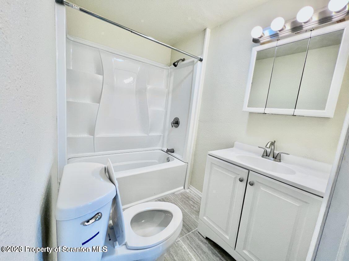 636 Beech Street, Unit 2 Scranton, PA 18505 - Photo 10 of 26 a bathroom with a sink a toilet and shower