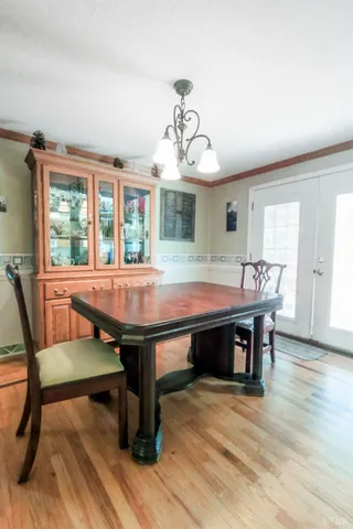 a view of hallway with wooden floor