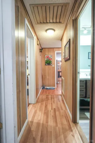 a bedroom with furniture and a wooden floor