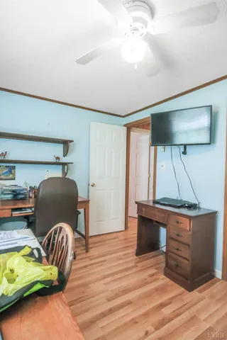 a room with a lamp and wooden floor