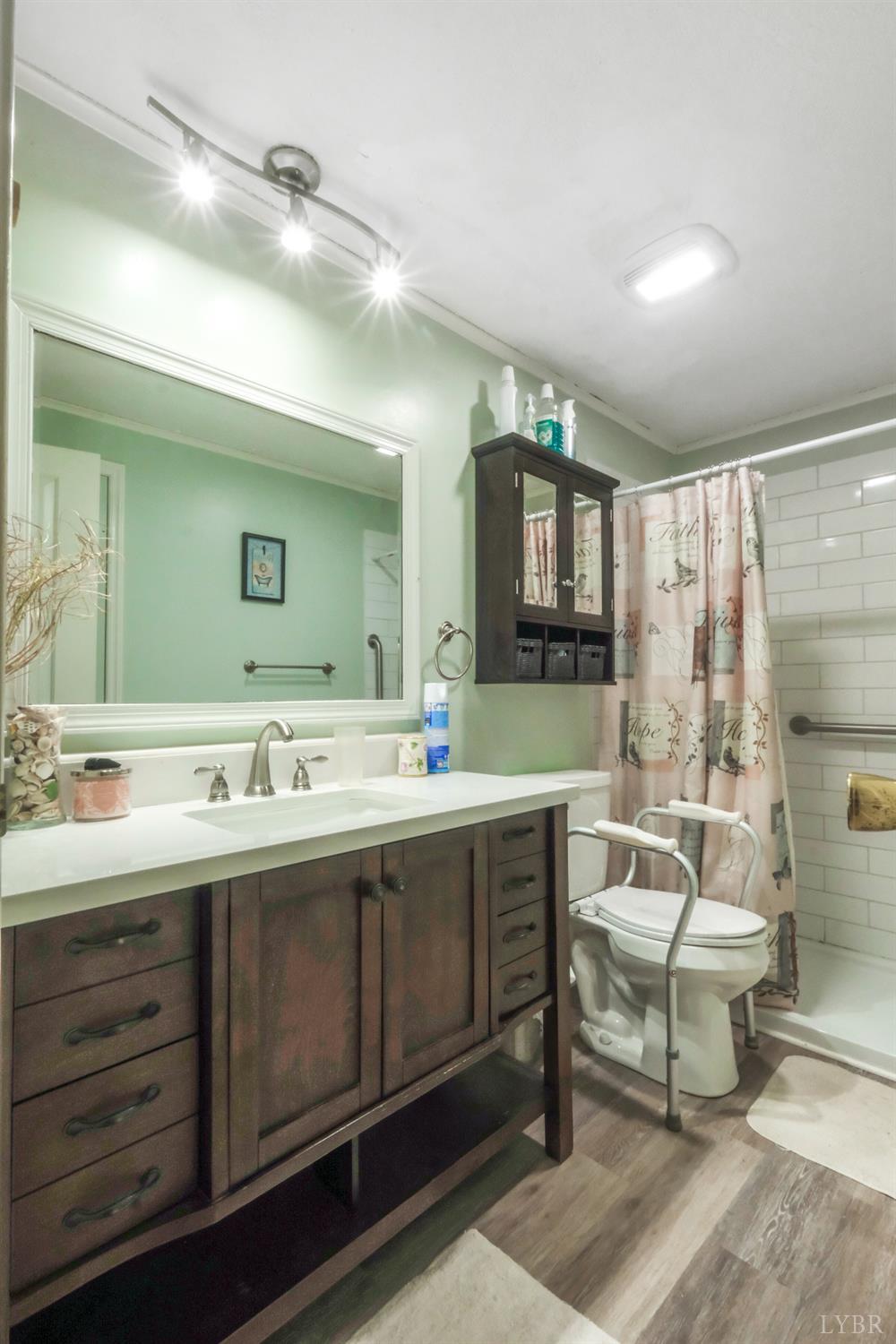 200 Carden Road Phenix, VA 23959 - Photo 16 of 45 a spacious bathroom with a sink mirror and a bathtub