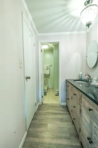a bathroom with a granite countertop sink mirror and vanity