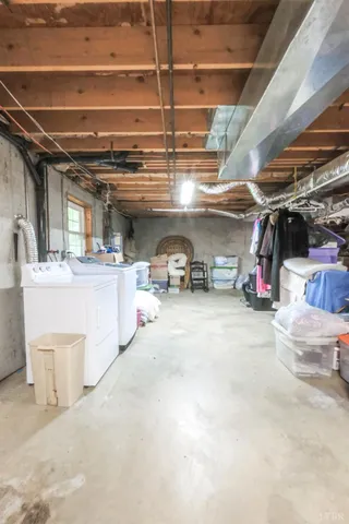 a view of a patio with table and chairs