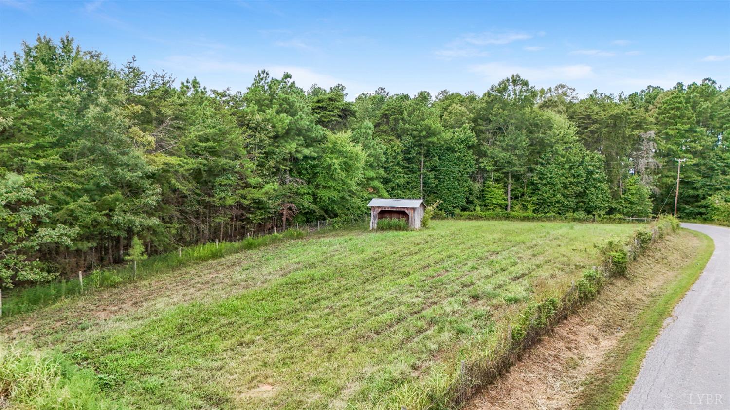 200 Carden Road Phenix, VA 23959 - Photo 36 of 45 a view of a garden with a bench