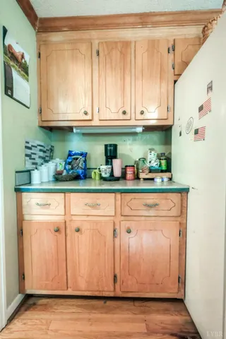 a room with a table chairs and wooden floor