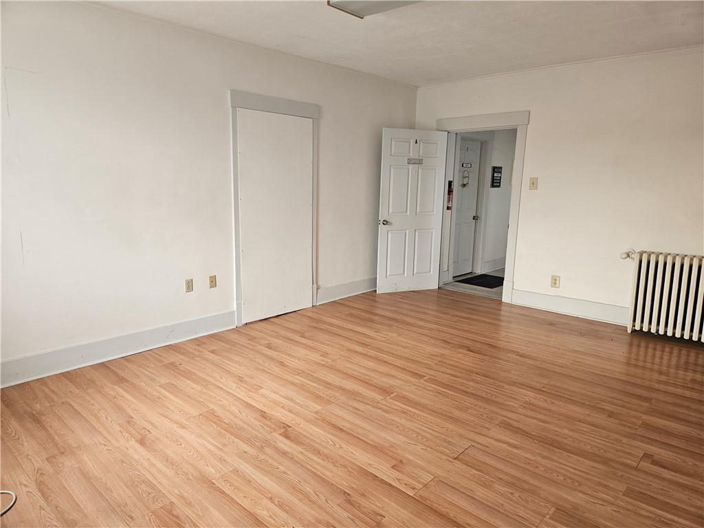 210 Bridge Street, Unit A Bridgewater, PA 15009 - Photo 2 of 5 a view of empty room with wooden floor