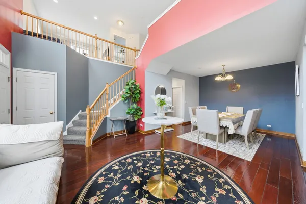 a living room with furniture and a rug