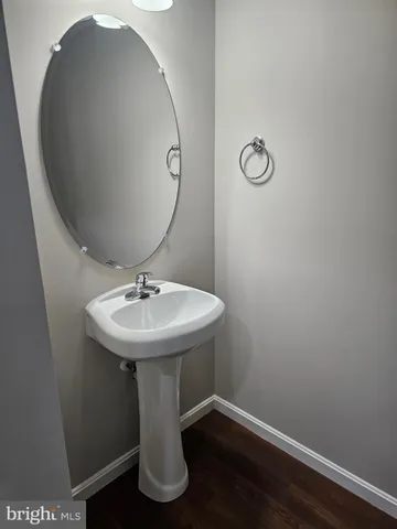 a bathroom with a sink and mirror