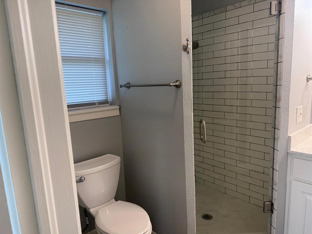 626 Stiff Chapel Road Gunter, TX 75058 - Photo 22 of 40 a white toilet sitting next to a shower