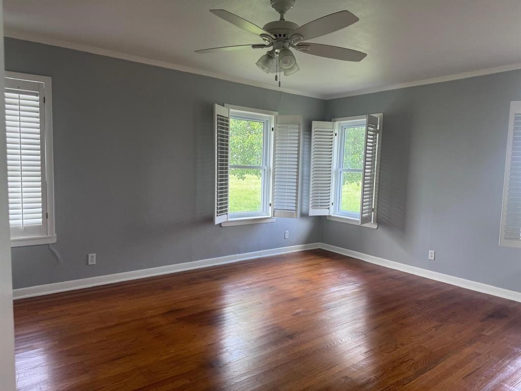 626 Stiff Chapel Road Gunter, TX 75058 - Photo 24 of 40 a view of an empty room with wooden floor and a window