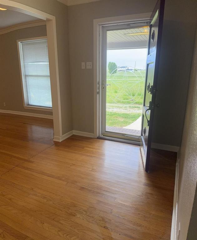 626 Stiff Chapel Road Gunter, TX 75058 - Photo 39 of 40 a view of an empty room with wooden floor and a window