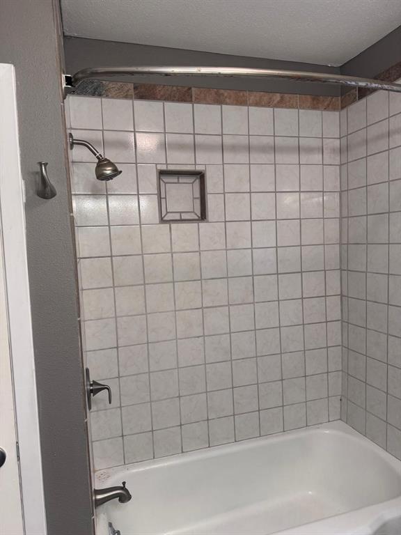 626 Stiff Chapel Road Gunter, TX 75058 - Photo 4 of 40 a bathroom with a shower and a bathtub