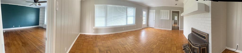 626 Stiff Chapel Road Gunter, TX 75058 - Photo 5 of 40 a view of an empty room with wooden floor and a window