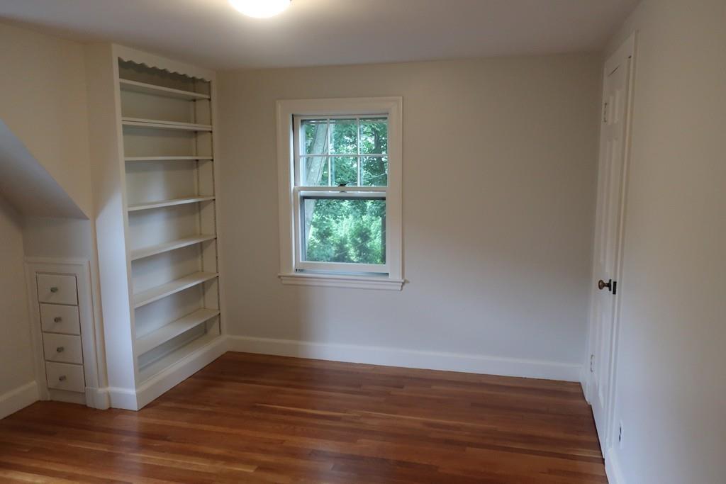4 Payson Street Lexington, MA 02421 - Photo 15 of 22 a view of a room with wooden floor and window