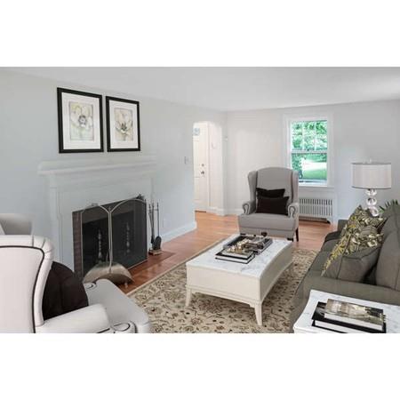 4 Payson Street Lexington, MA 02421 - Photo 3 of 22 a living room with furniture and a fireplace