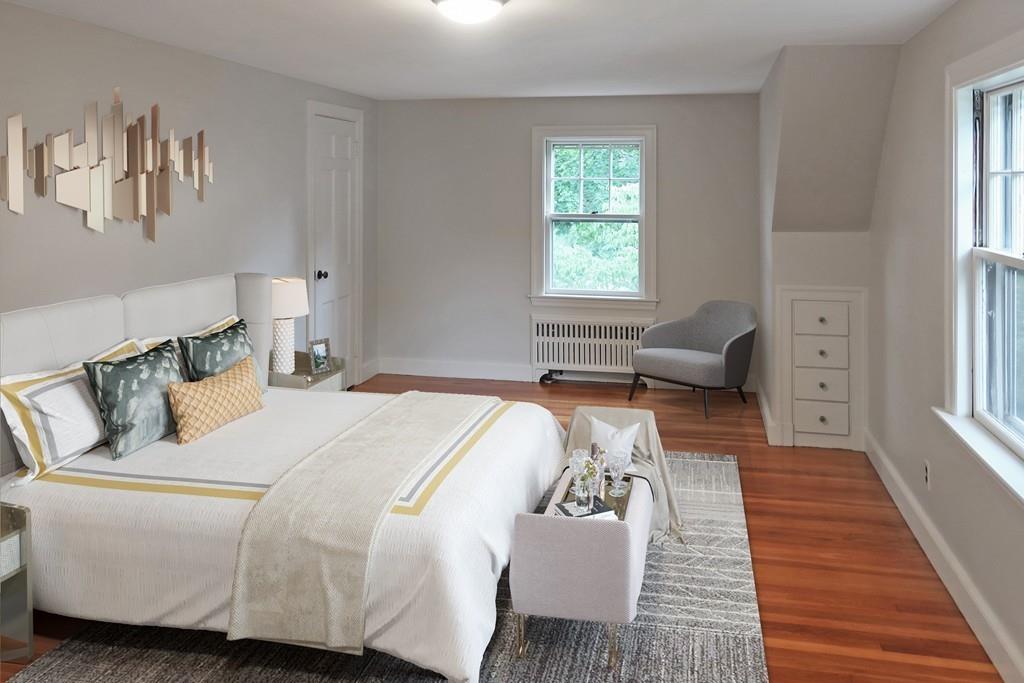 4 Payson Street Lexington, MA 02421 - Photo 6 of 22 a bed room with a bed and a couch