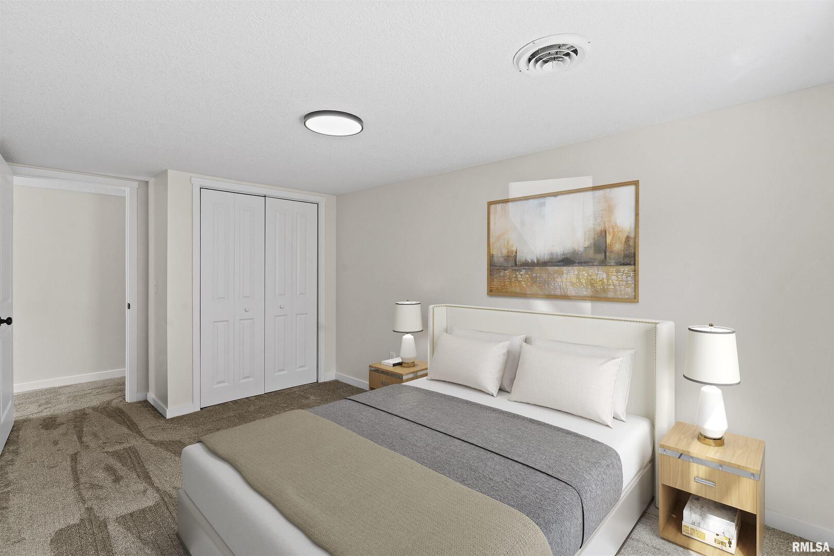 1501 43rd Street Moline, IL 61265 - Photo 12 of 27 a bedroom with a bed and a painting on the wall