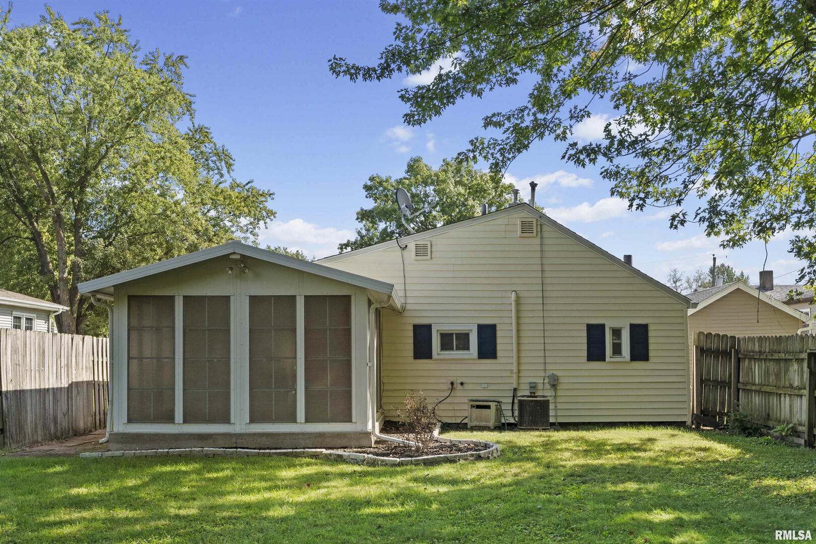 1501 43rd Street Moline, IL 61265 - Photo 17 of 27 a view of a house with a yard