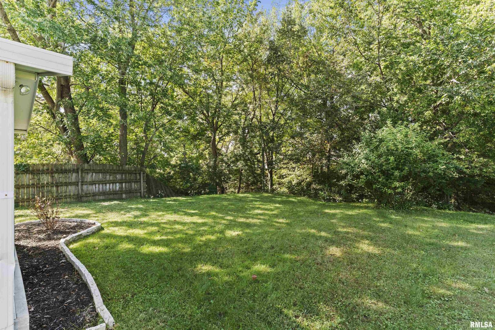 1501 43rd Street Moline, IL 61265 - Photo 19 of 27 a view of a backyard with large trees