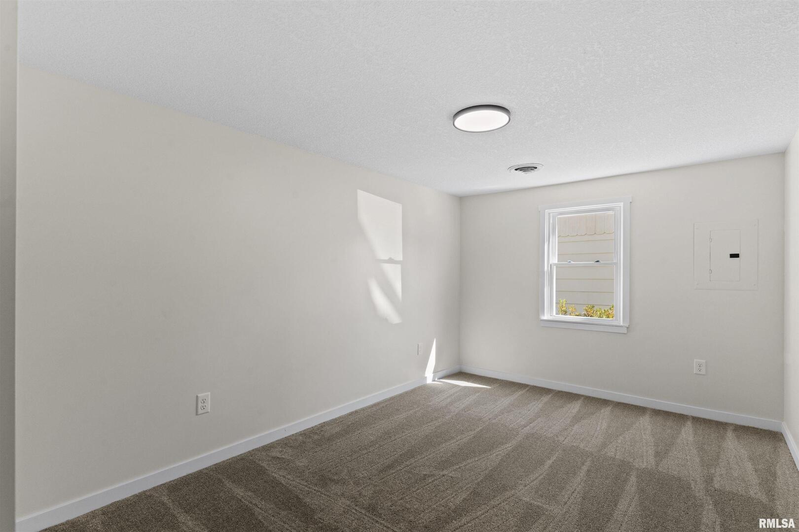 1501 43rd Street Moline, IL 61265 - Photo 23 of 27 an empty room with a window