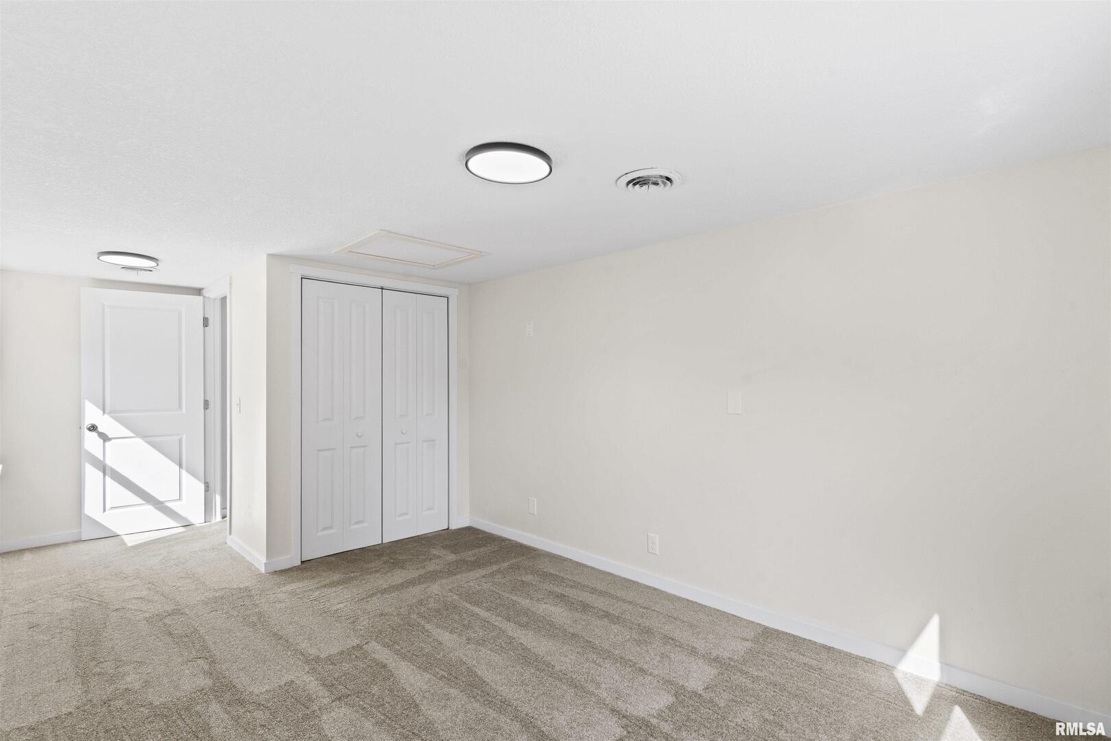 1501 43rd Street Moline, IL 61265 - Photo 26 of 27 a view of a livingroom with an empty space and a window