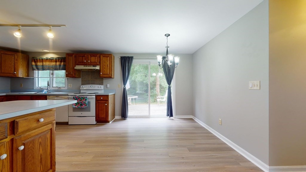1 Friendly Road Forestdale, MA 02644 - Photo 11 of 38 a kitchen with stainless steel appliances granite countertop a sink stove and refrigerator