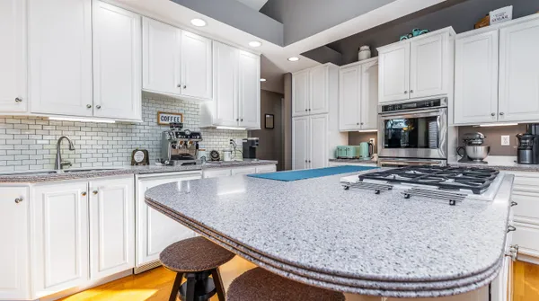 a bedroom with a bed and a flat tv screen next to a window