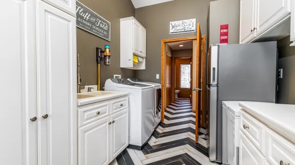 a living room with furniture and large windows