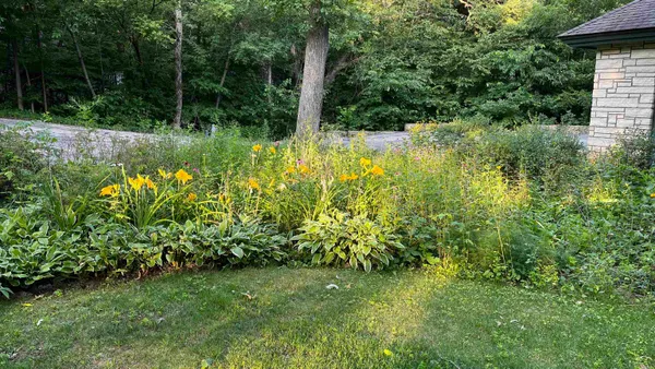 a kitchen with white cabinets and appliances