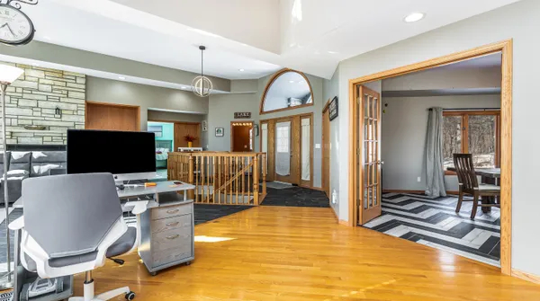 a kitchen with white cabinets and appliances