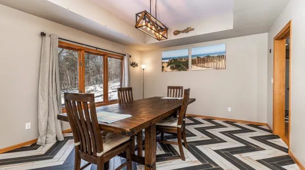 a kitchen with a refrigerator and white cabinets