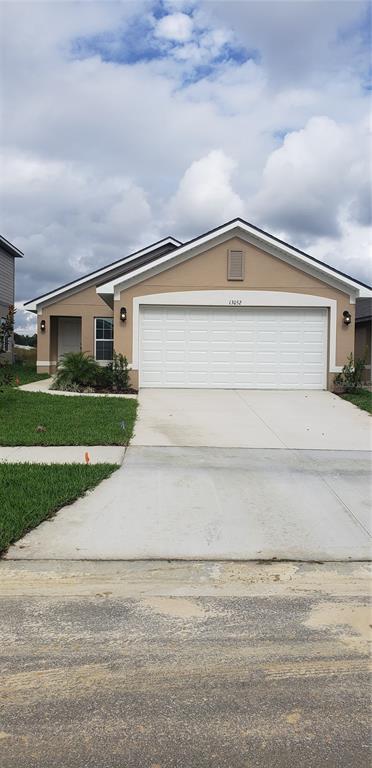 13052 Ogden Glade Road Dade City, FL 33525 - Photo 1 of 1 a front view of house with yard