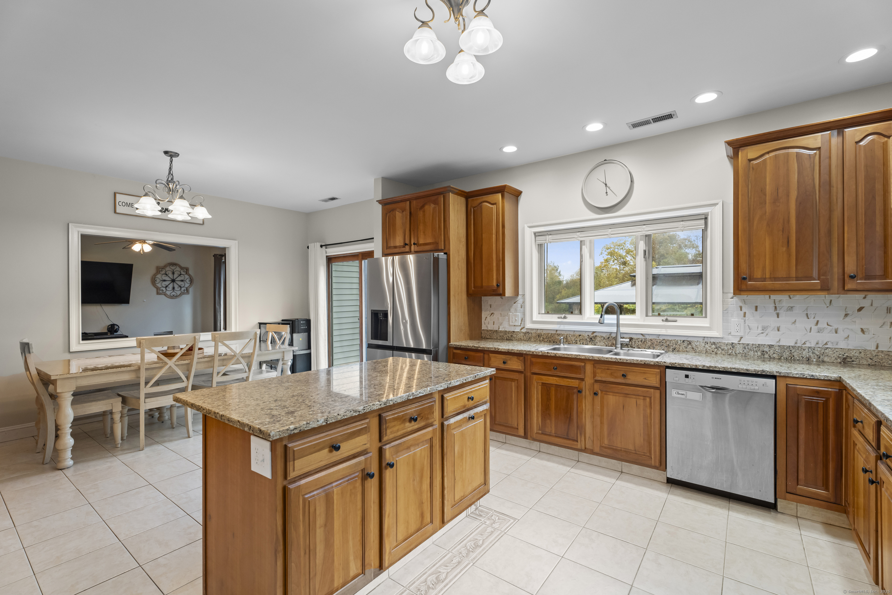 305 Killorin Road Watertown, CT 06795 - Photo 11 of 40 a kitchen with granite countertop stainless steel appliances a stove sink and microwave