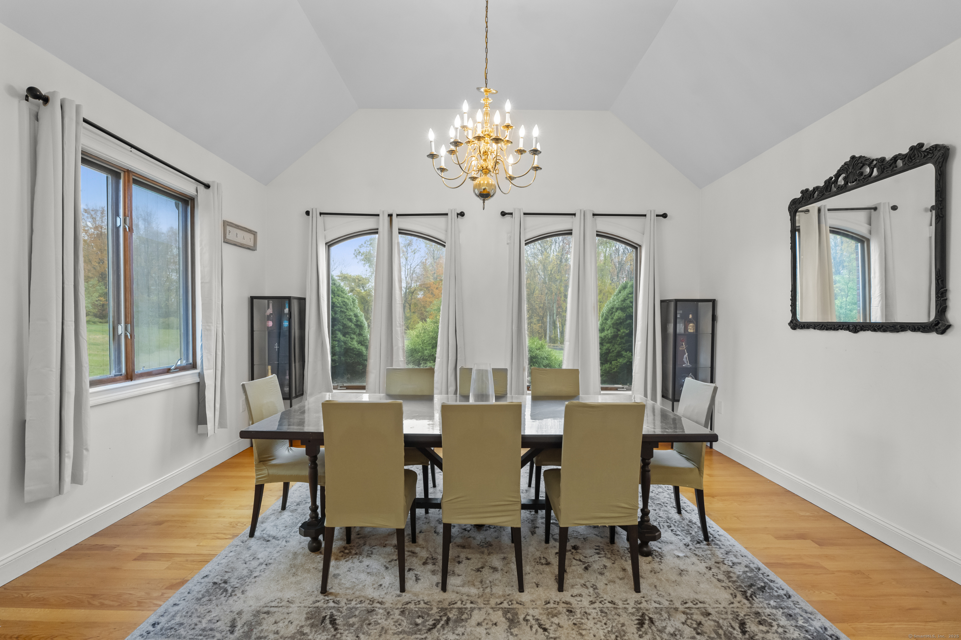 305 Killorin Road Watertown, CT 06795 - Photo 15 of 40 a view of a dining room with furniture wooden floor and chandelier