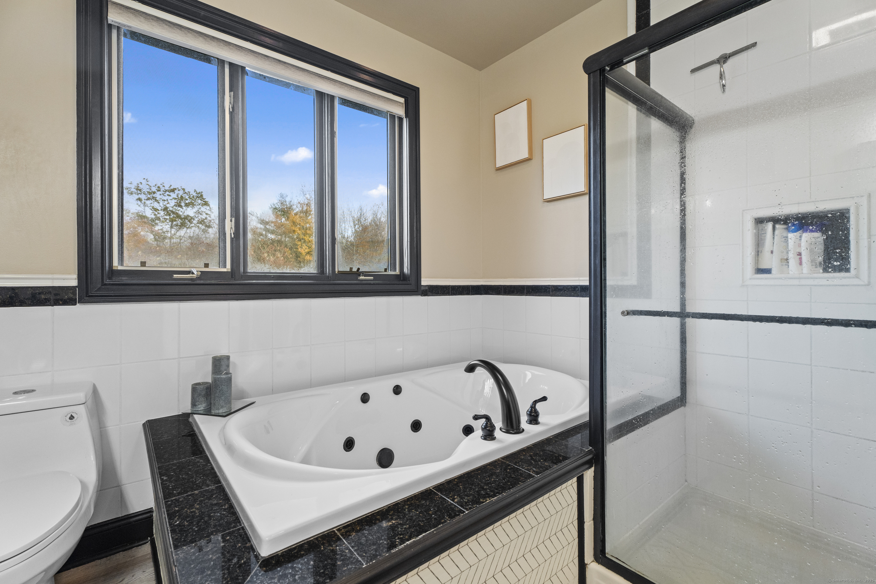 305 Killorin Road Watertown, CT 06795 - Photo 20 of 40 a bathroom with a bathtub and a toilet