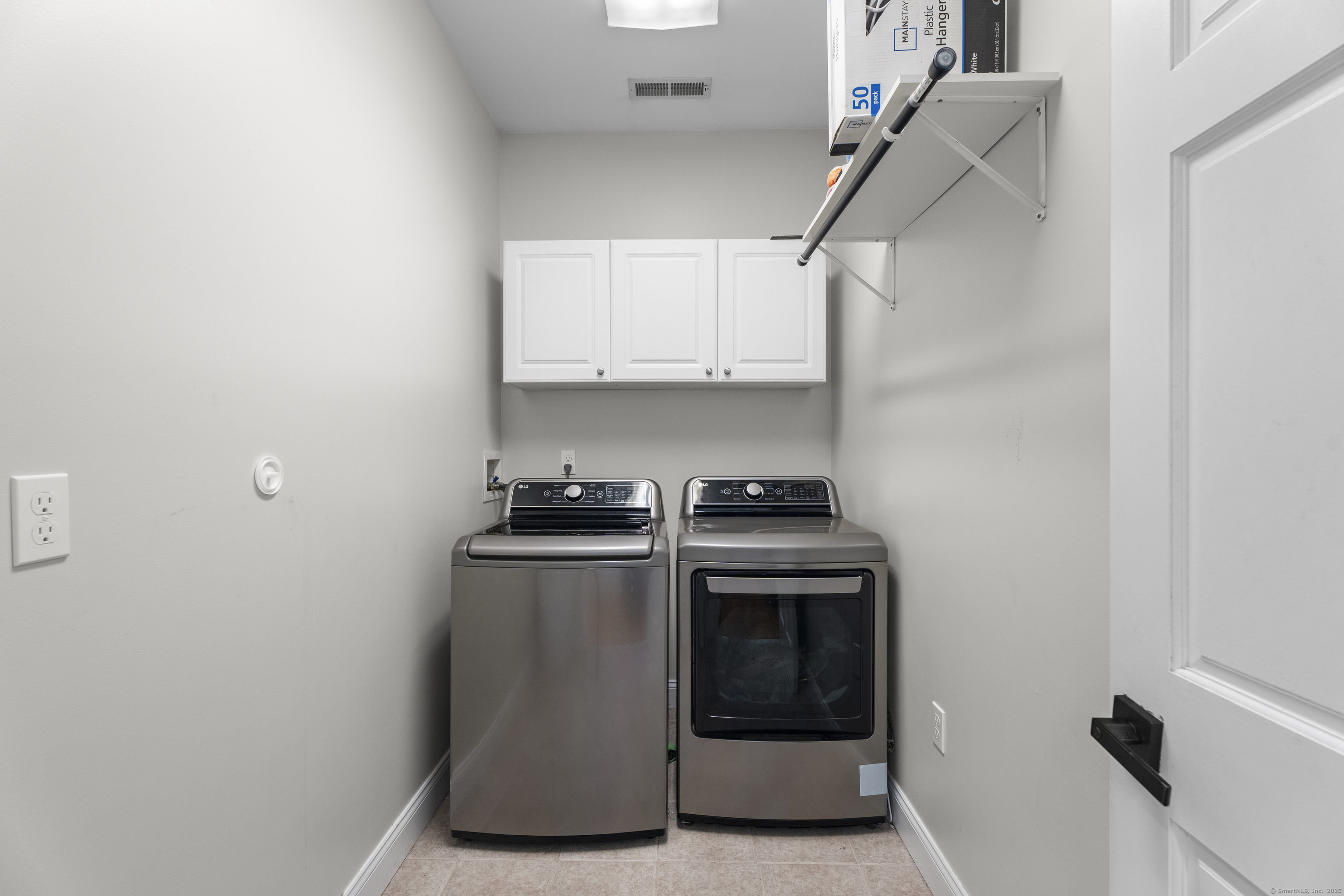 305 Killorin Road Watertown, CT 06795 - Photo 25 of 40 a kitchen with stainless steel appliances a stove and white cabinets