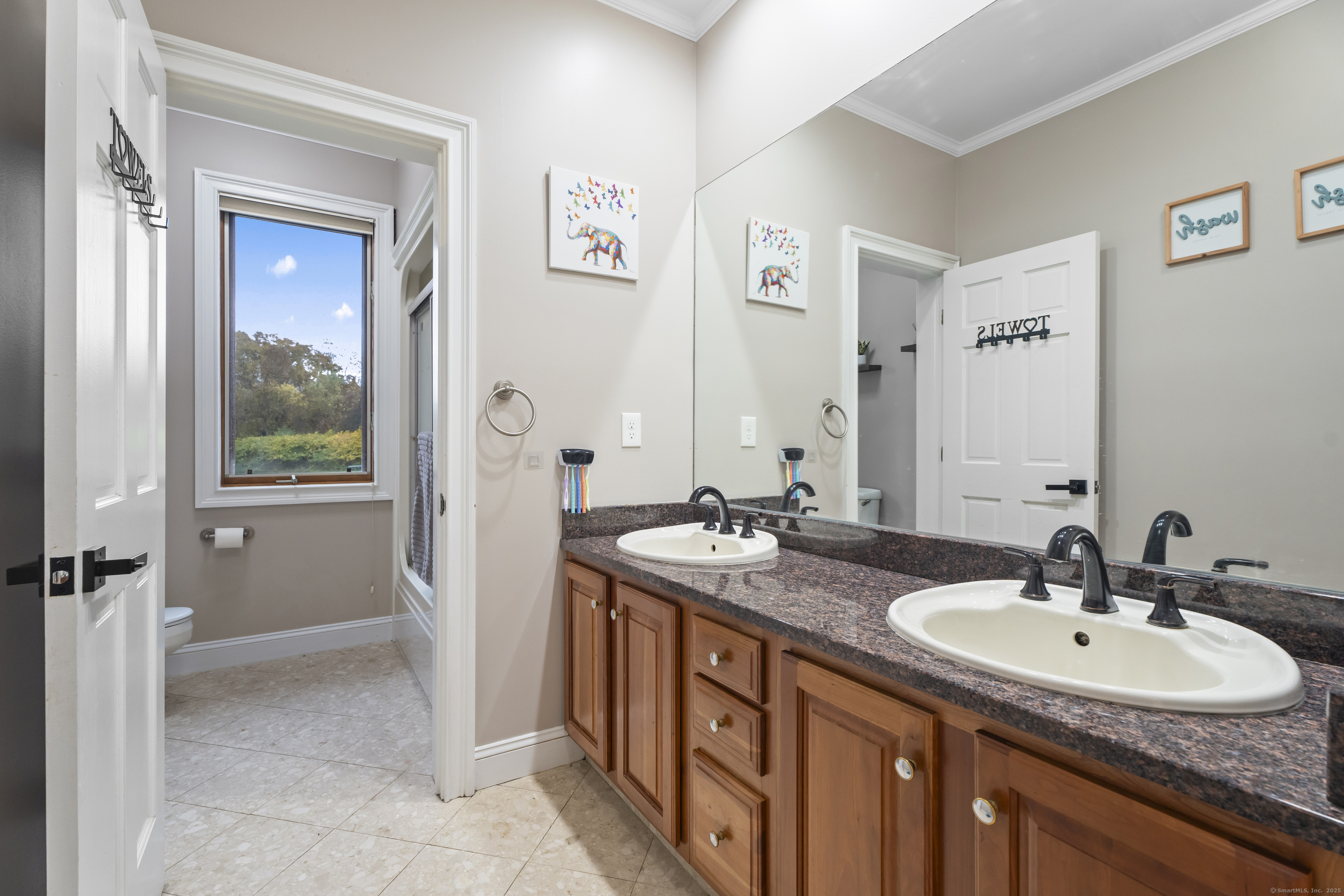 305 Killorin Road Watertown, CT 06795 - Photo 26 of 40 a bathroom with a sink and a mirror
